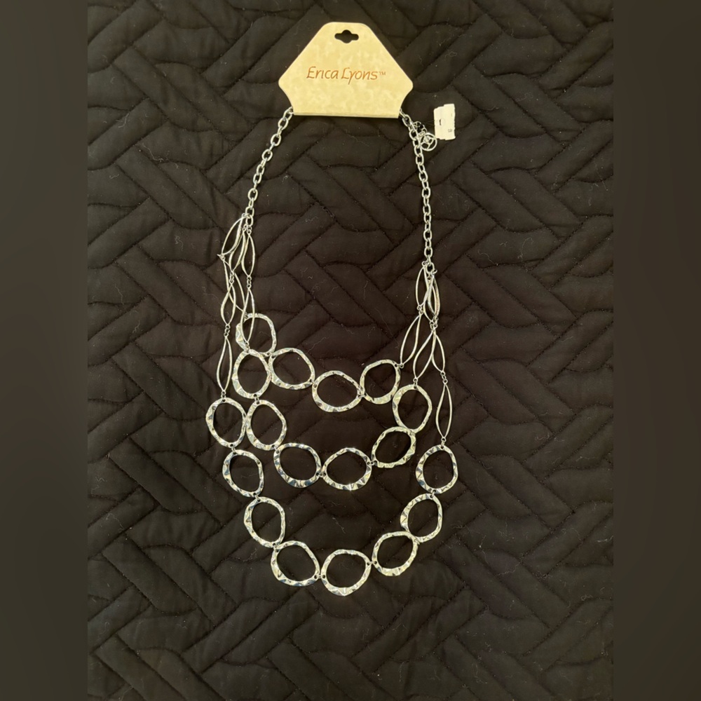 Silver necklace NWT. Three linked strands.  Adjustable length. Erica Lyons
